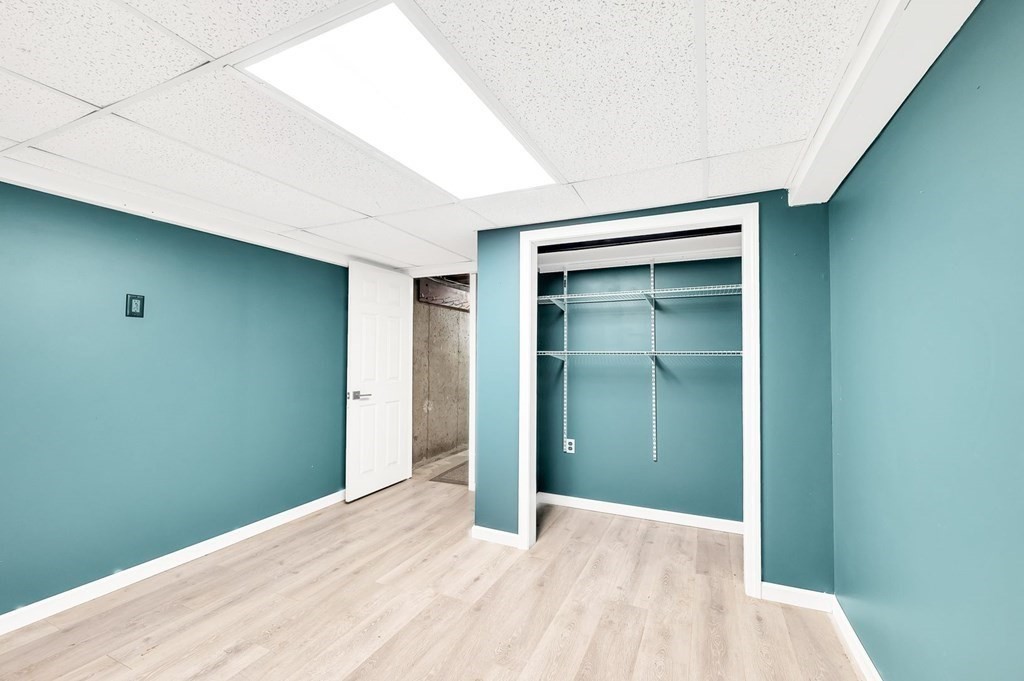 516 Old Wales Road Monson, MA 01057 - Photo 35 of 36 a view of an empty room with closet and wooden floor