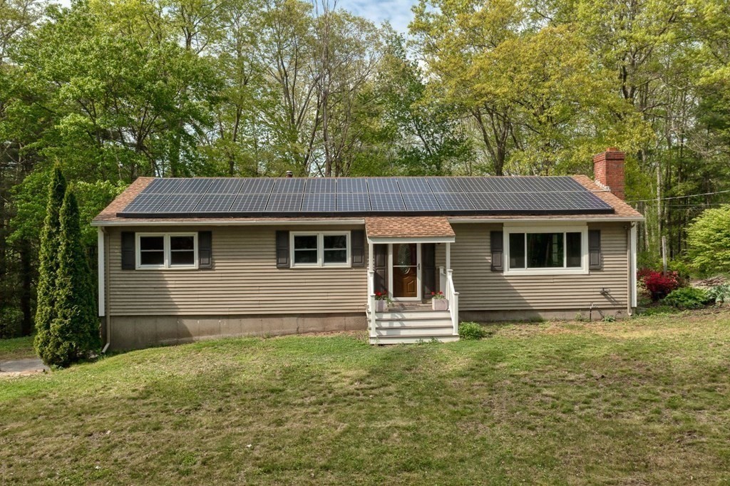 516 Old Wales Road Monson, MA 01057 - Photo 8 of 36 a front view of a house with garden