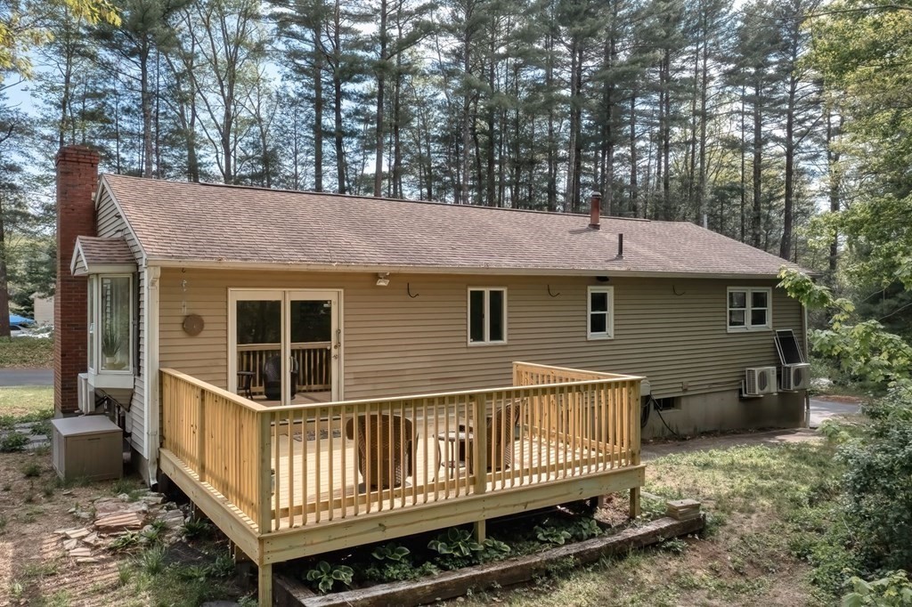 516 Old Wales Road Monson, MA 01057 - Photo 9 of 36 a view of a house with a yard and deck