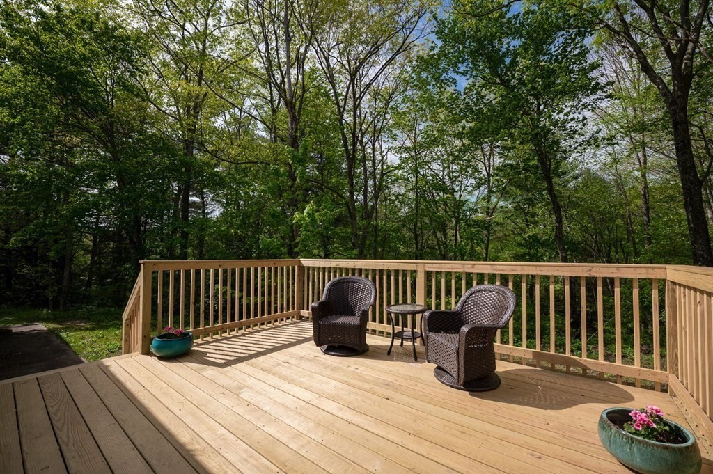 516 Old Wales Road Monson, MA 01057 - Photo 10 of 36 a view of balcony with wooden floor and outdoor seating