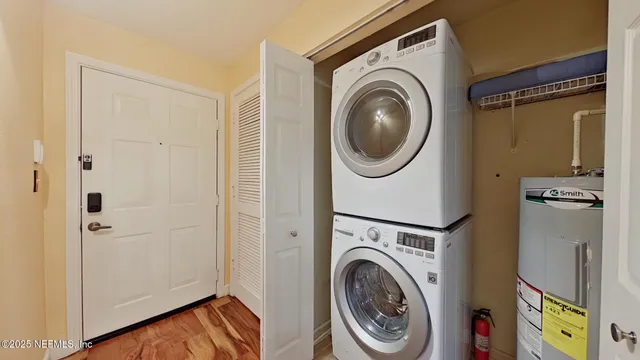 a view of a hallway with washer and dryer