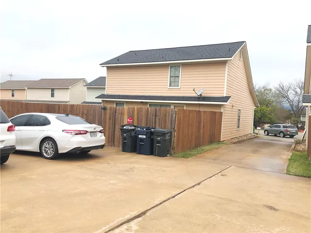 a view of parking area with parked cars