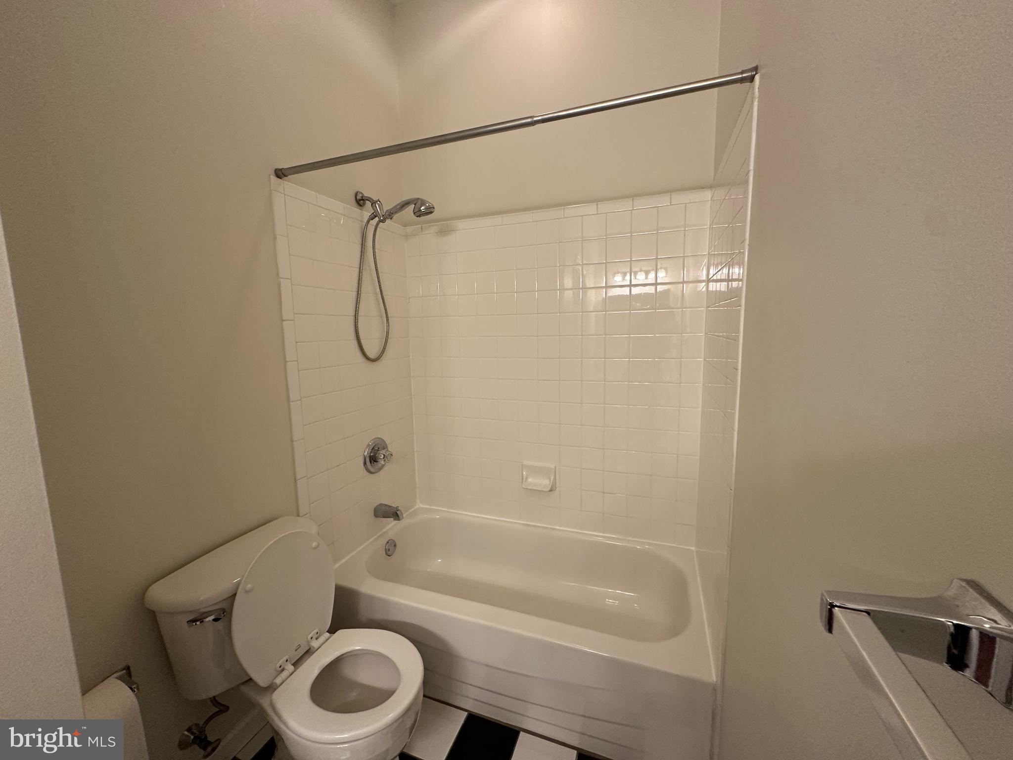 141 North 2nd Street, Unit 3C Philadelphia, PA 19106 - Photo 19 of 28 a bathroom with a granite countertop bathtub shower sink vanity and toilet