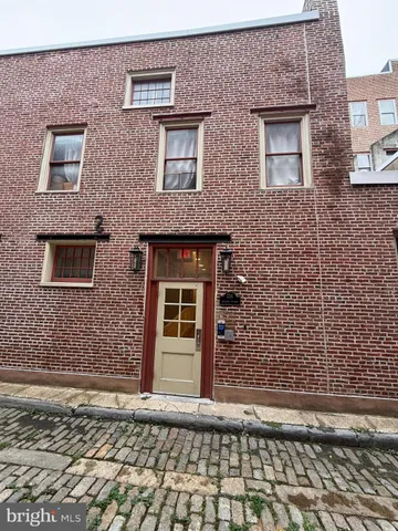 a view of a brick house with a door