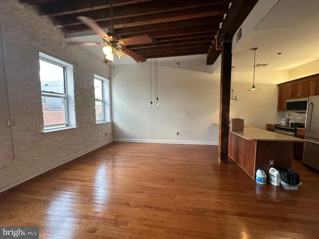 a view of kitchen and dining room with wooden floor