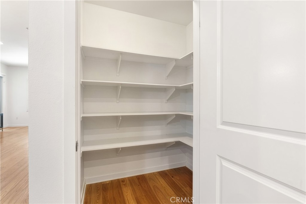 21 Gramercy, Unit 102 Irvine, CA 92612 - Photo 10 of 30 Walk in pantry offering exceptional kitchen storage and everyday convenience.
