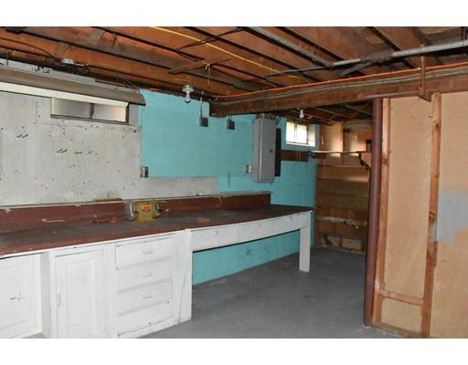50 Mason Road Dudley, MA 01571 - Photo 23 of 26 a room with cabinets and a wooden chair