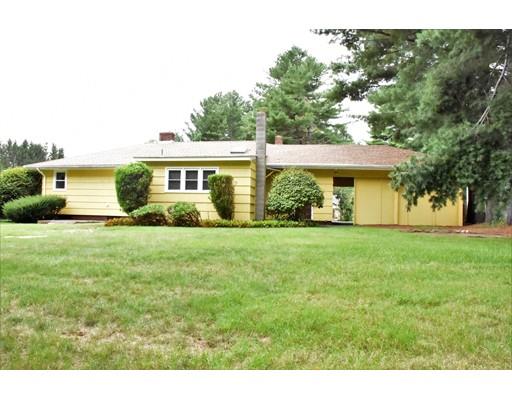 50 Mason Road Dudley, MA 01571 - Photo 3 of 26 a front view of a house with a yard