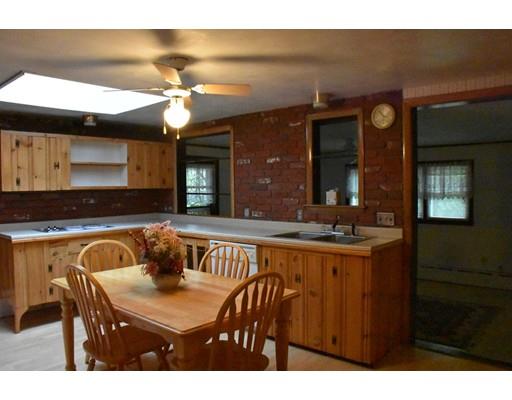 50 Mason Road Dudley, MA 01571 - Photo 8 of 26 a kitchen with a table and chairs in it