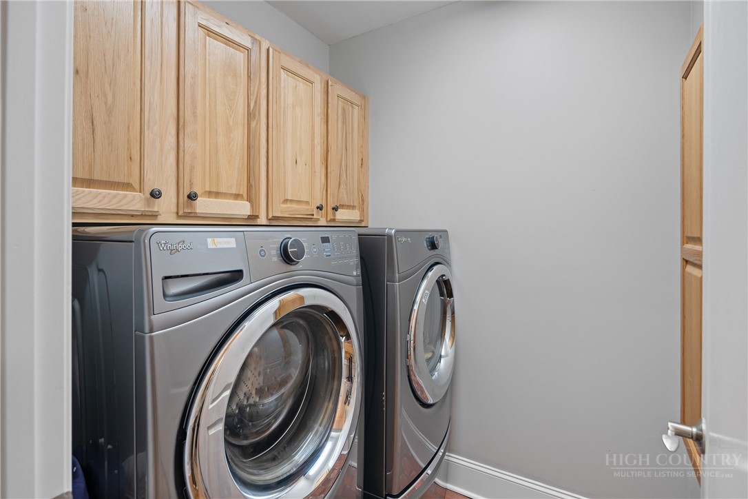 147 Riverside Park Court, Unit G2 Jefferson, NC 28640 - Photo 17 of 44 a utility room with dryer and washer