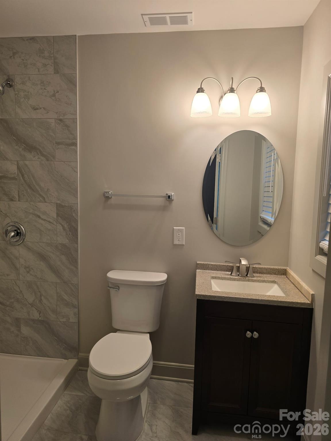 126 Sunset Drive Chester, SC 29706 - Photo 20 of 31 a bathroom with a toilet sink and mirror