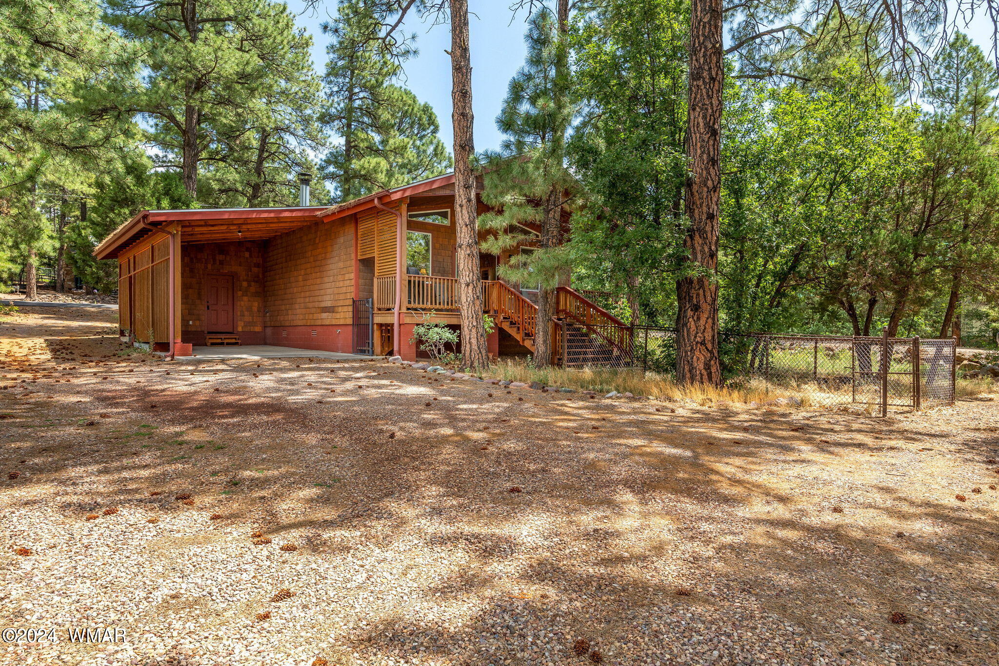 175 North Hopi Way Lakeside, AZ 85929 - Photo 15 of 20 SIDE OF HOME WITH CARPORT VIEW