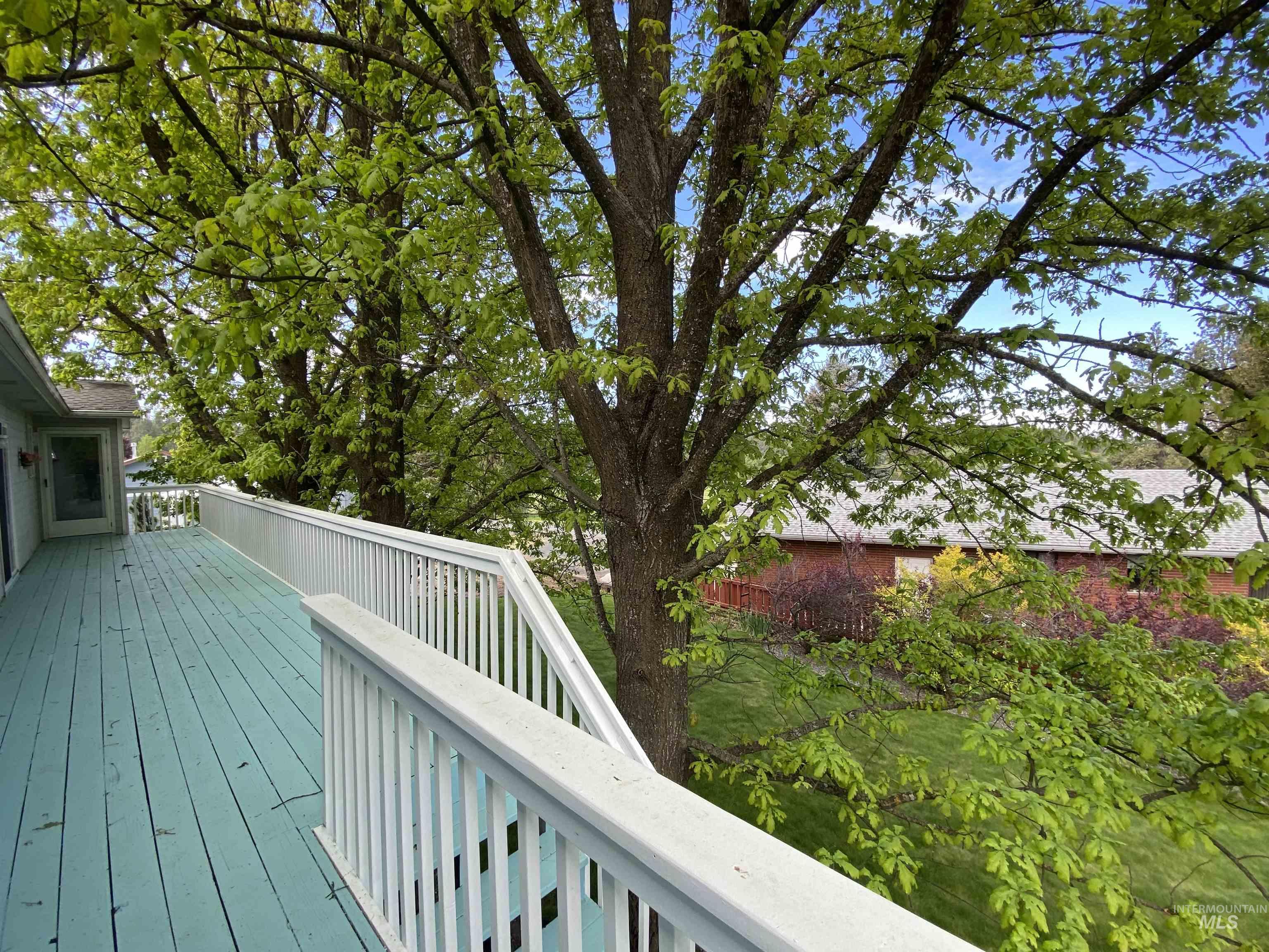 310 Larch Street Potlatch, ID 83855 - Photo 47 of 50 Spacious outdoor deck with teal-painted wood-finish flooring and white railing