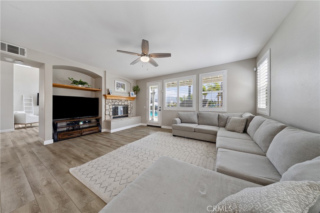 32985 Novara Court Temecula, CA 92592 - Photo 16 of 56 Open Concept Family Room With Cozy Fireplace And Seamless Flow To The Kitchen