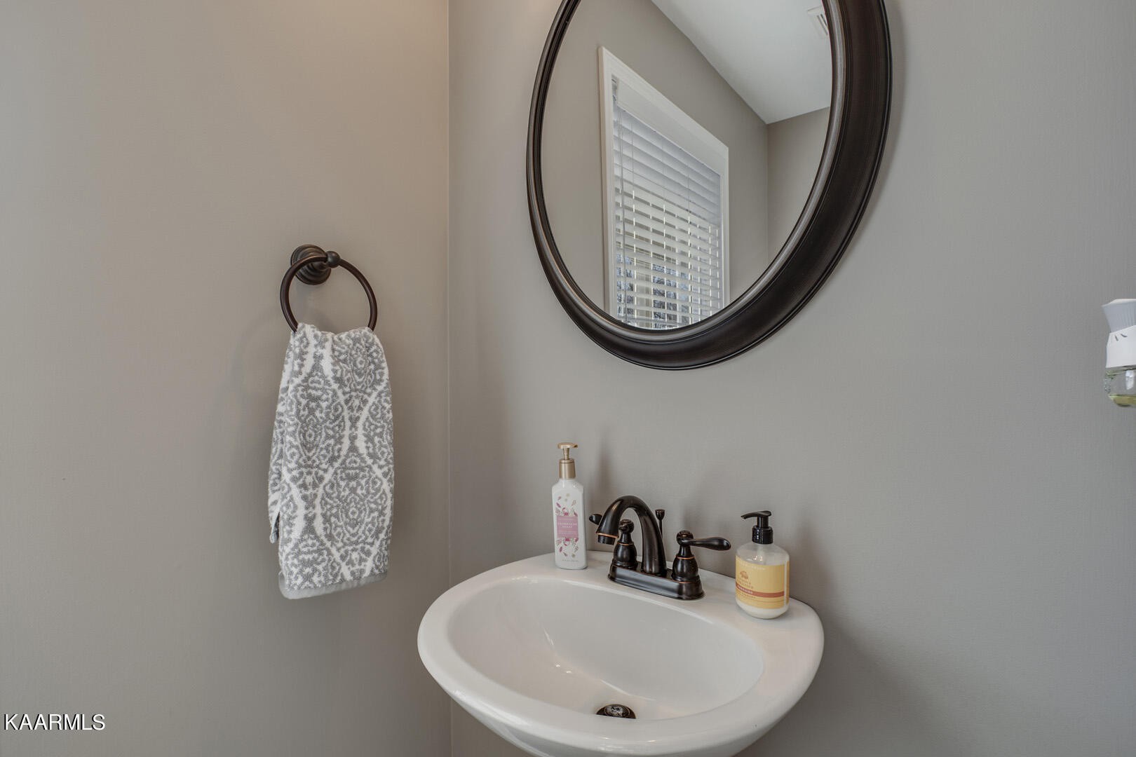 3417 Boulder Point Lane Powell, TN 37849 - Photo 15 of 31 a bathroom with a sink and a mirror