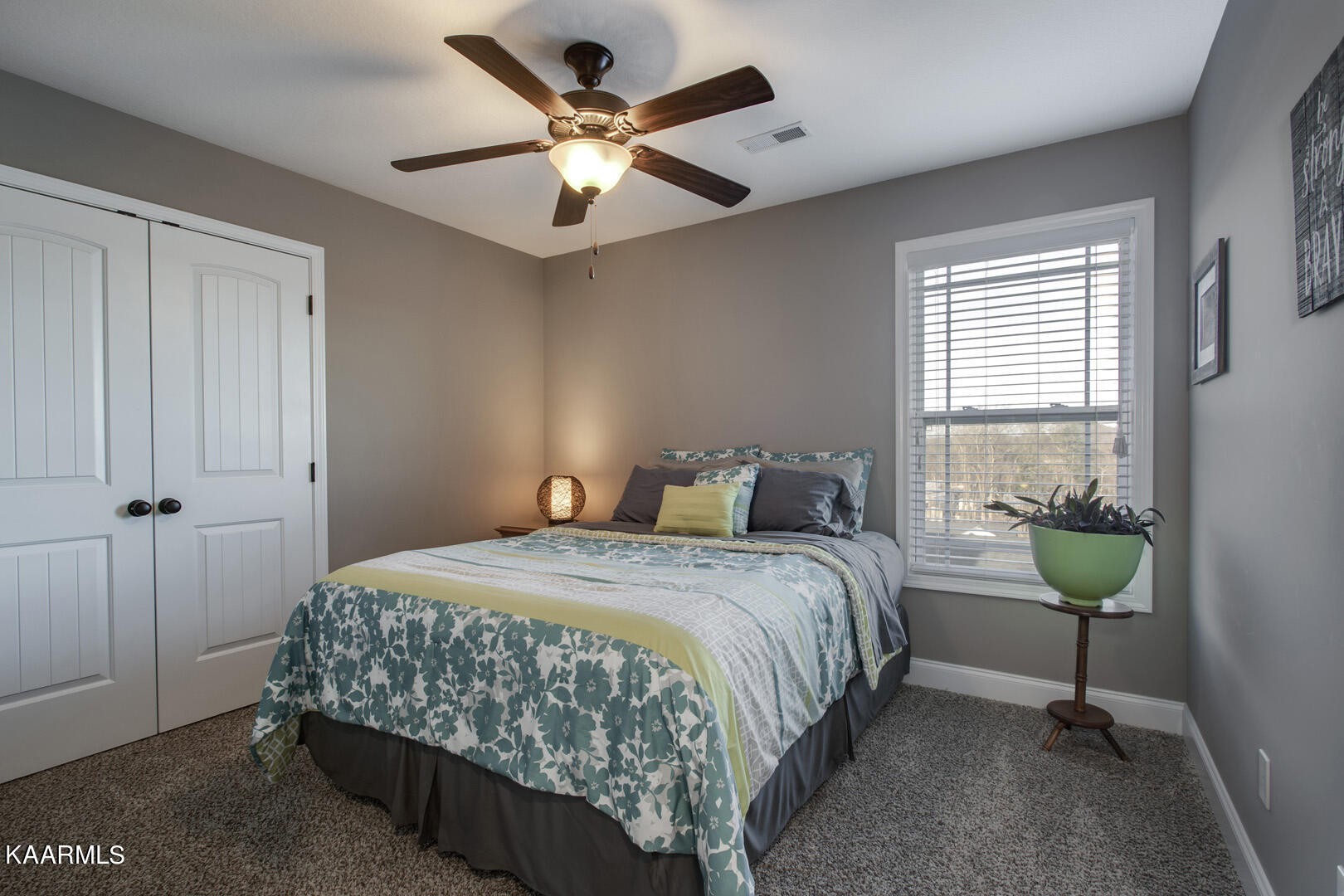 3417 Boulder Point Lane Powell, TN 37849 - Photo 23 of 31 a bedroom with a bed a chandelier and a window