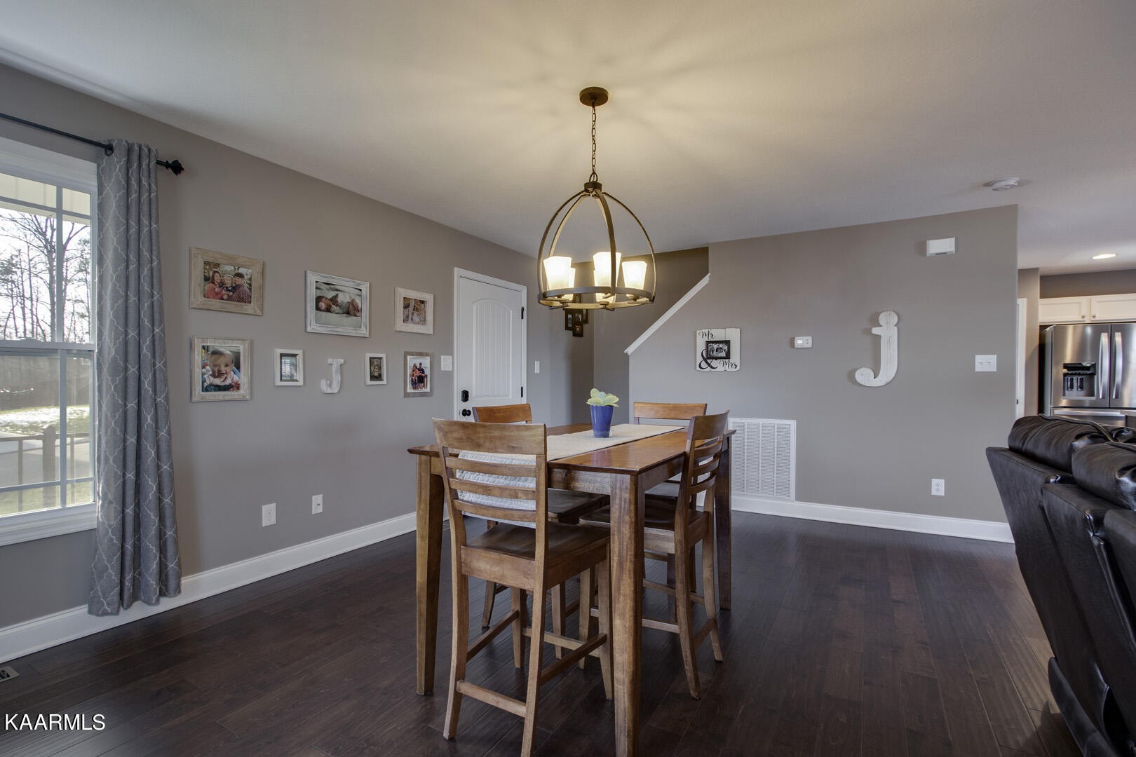 3417 Boulder Point Lane Powell, TN 37849 - Photo 5 of 31 a view of a dining room with furniture window and wooden floor