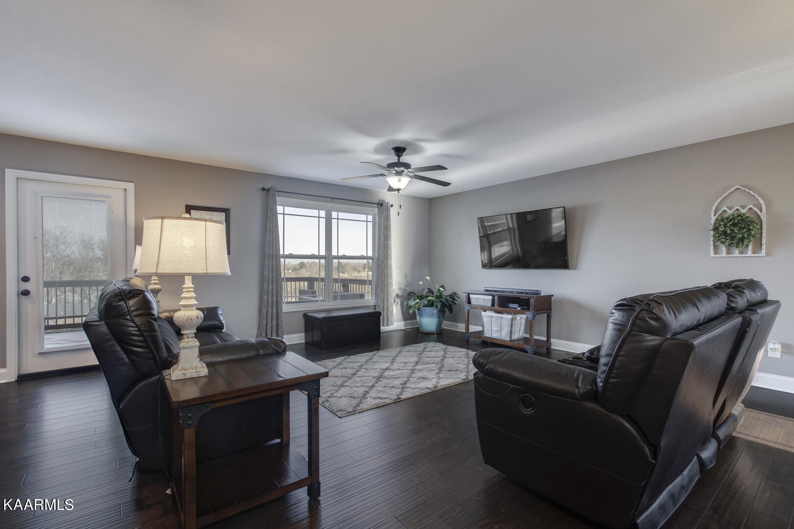 3417 Boulder Point Lane Powell, TN 37849 - Photo 6 of 31 a living room with furniture a fireplace and a flat screen tv
