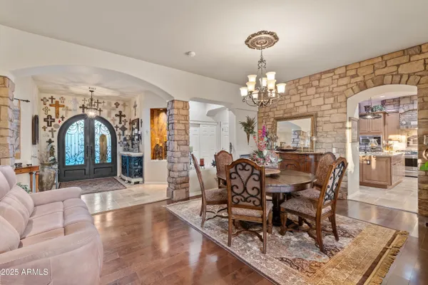 a large spacious bathroom with a granite countertop tub shower and mirror