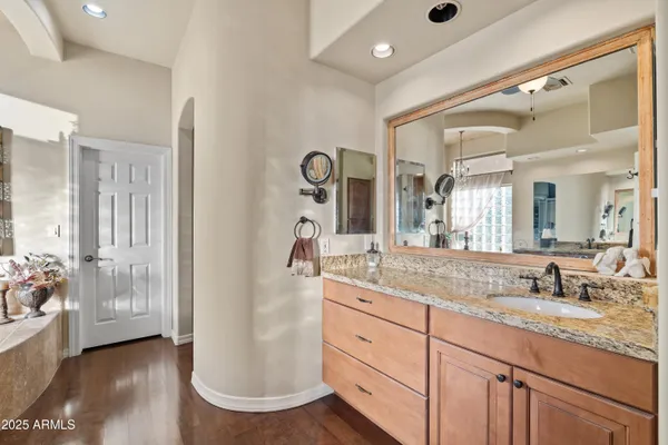 a view of a terrace with furniture and a garden