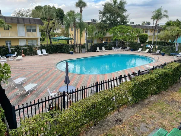 a view of a swimming pool with a patio