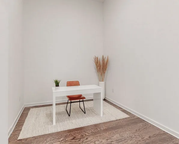 a view of a room with a table and chair