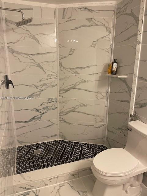 West Flagler Miami, FL 33125 - Photo 11 of 22 a bathroom with a toilet and a shower