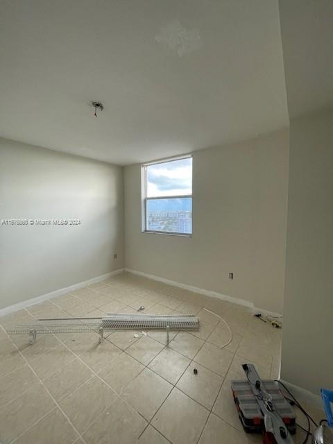 West Flagler Miami, FL 33125 - Photo 13 of 22 a view of a room with rack on the wall and a window