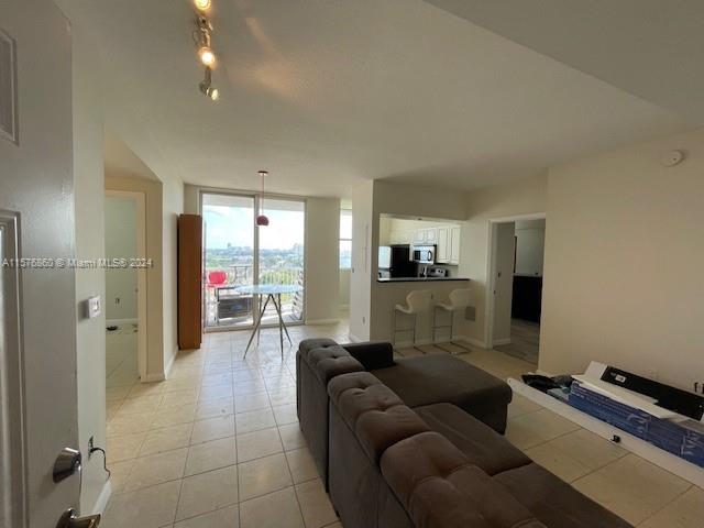 West Flagler Miami, FL 33125 - Photo 2 of 22 a living room with furniture and a flat screen tv