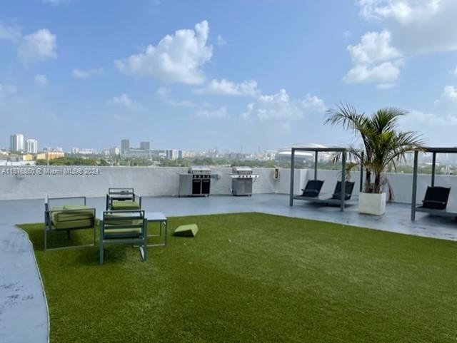 West Flagler Miami, FL 33125 - Photo 22 of 22 a view of a swimming pool and lounge chairs in back yard of the house