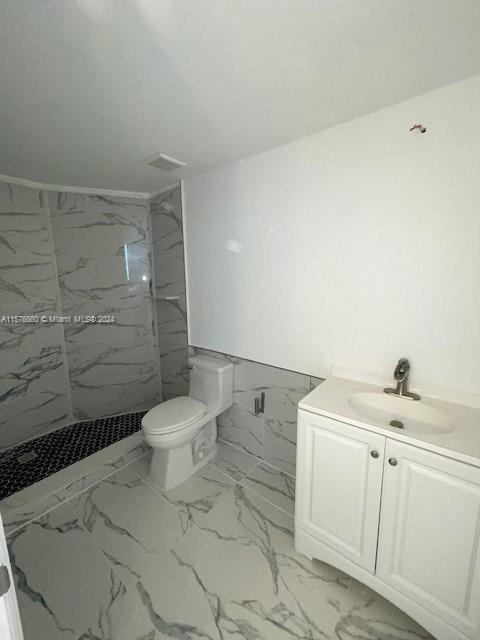 West Flagler Miami, FL 33125 - Photo 10 of 22 a bathroom with a toilet sink and shower