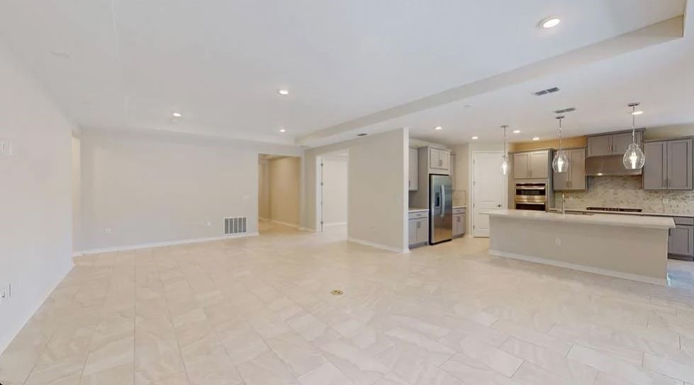 86571 Oar Row Yulee, FL 32097 - Photo 19 of 20 a view of an empty room with a kitchen