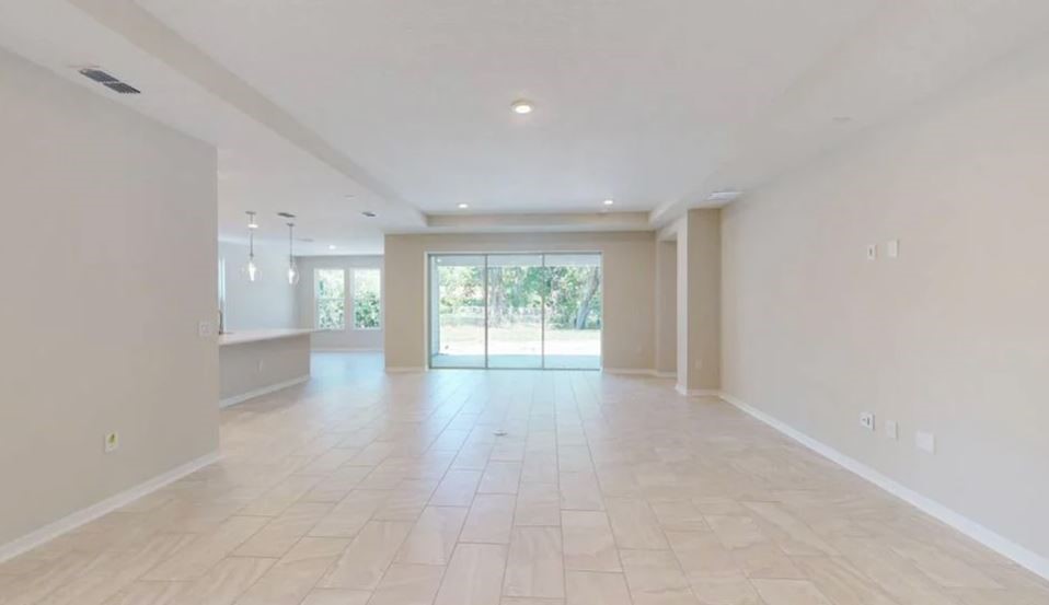 86571 Oar Row Yulee, FL 32097 - Photo 5 of 20 a view of an empty room with a window