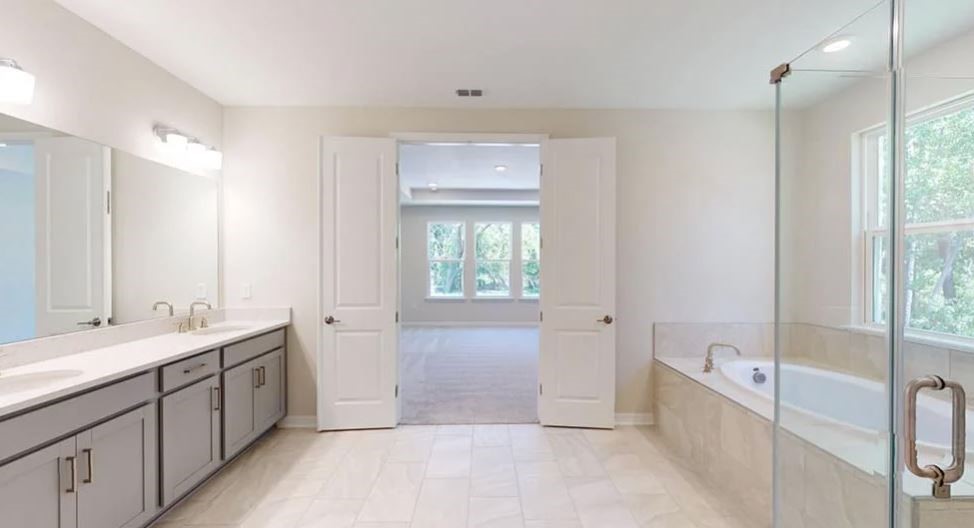 86571 Oar Row Yulee, FL 32097 - Photo 8 of 20 a bathroom with a tub sink and mirror