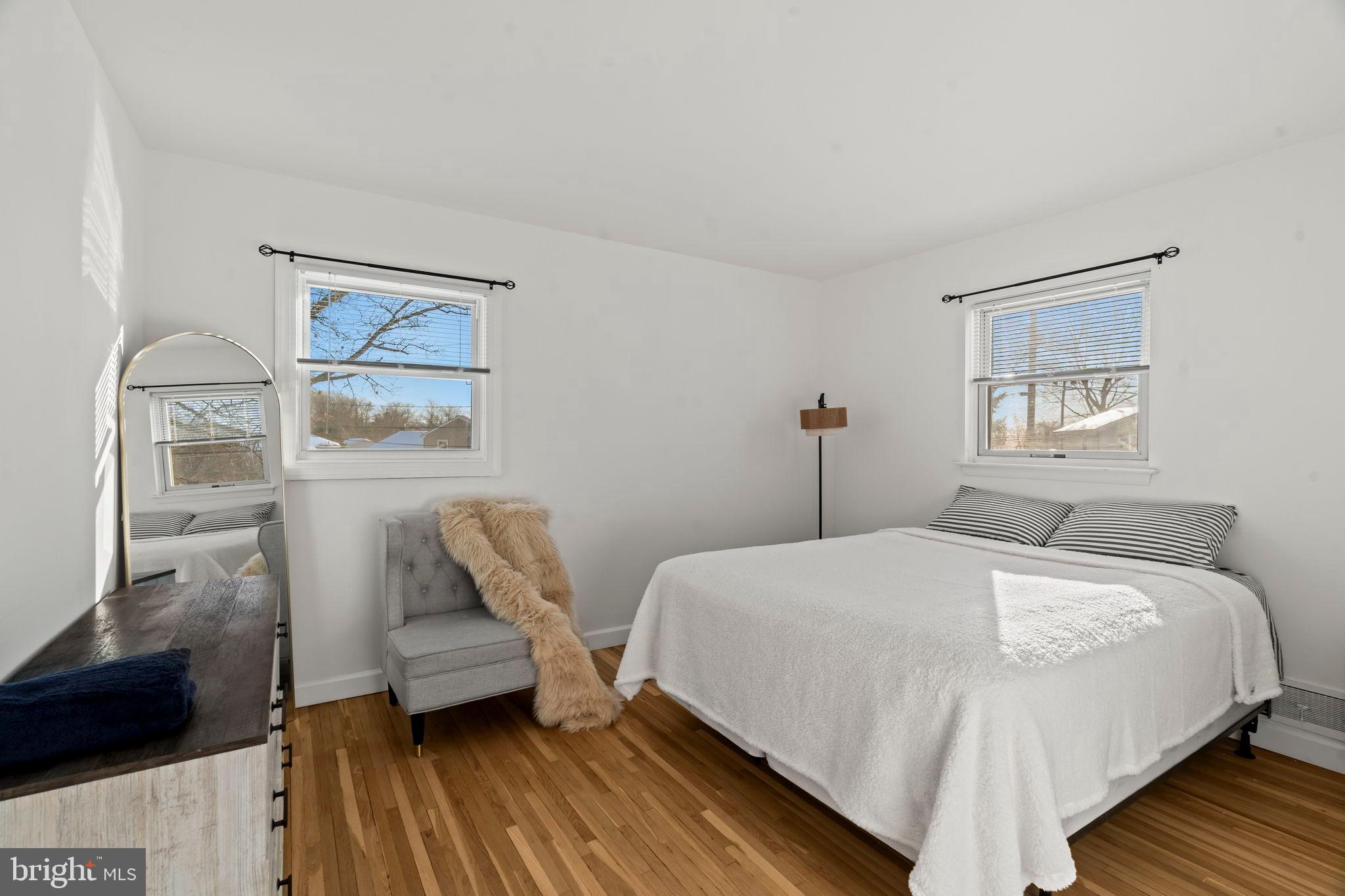 209 Front Street Mount Holly, NJ 08060 - Photo 11 of 35 a bedroom with a bed and wooden floor