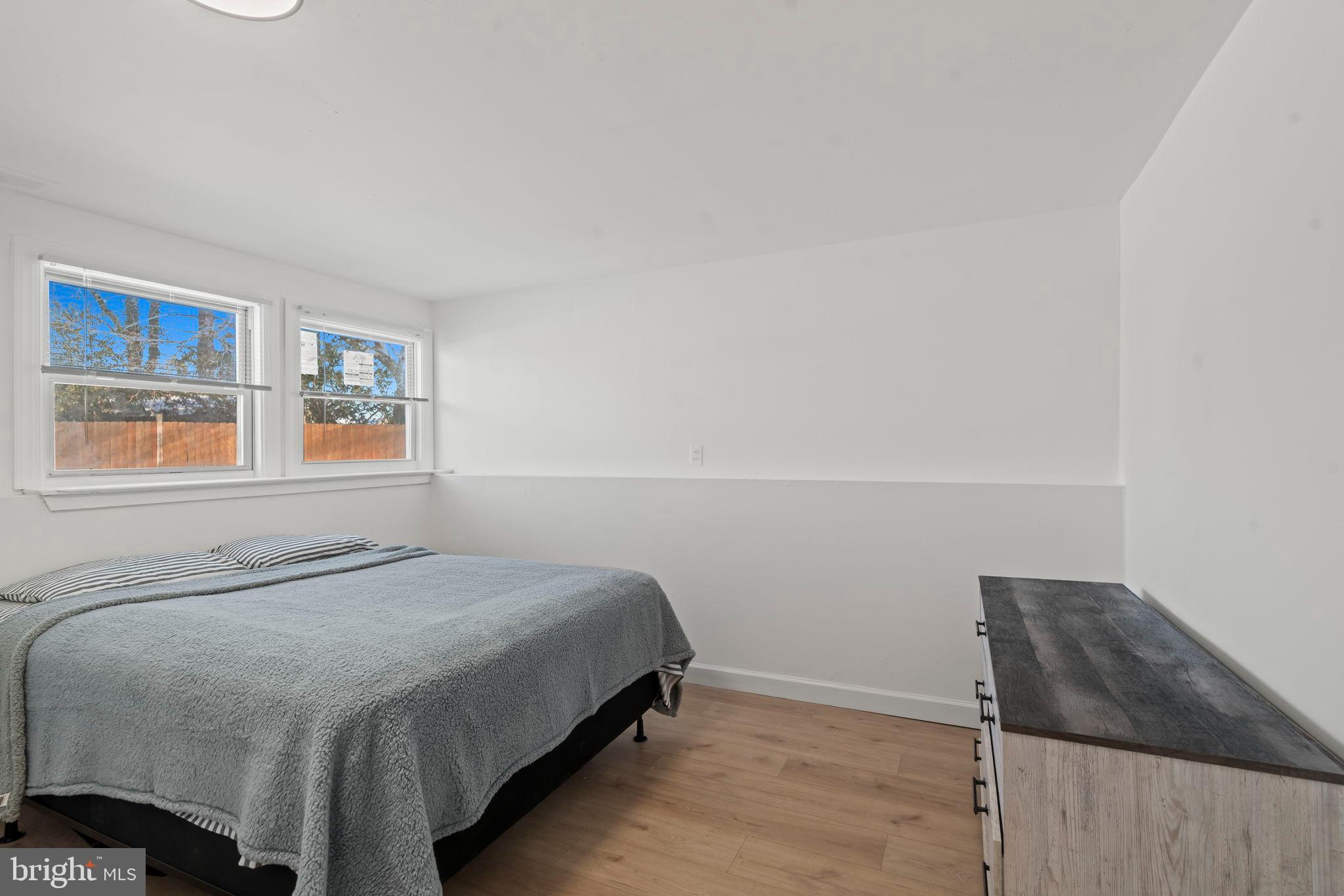 209 Front Street Mount Holly, NJ 08060 - Photo 20 of 35 a bedroom with a bed and a window