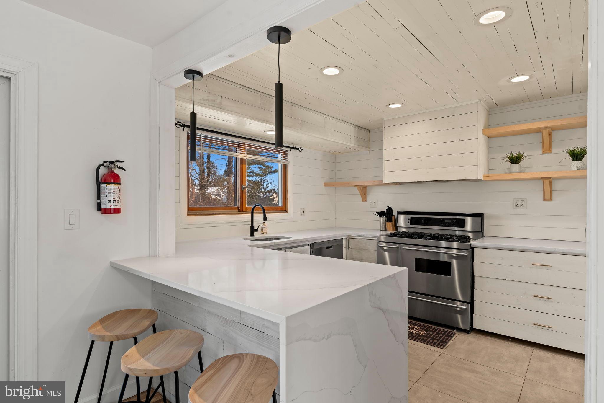 209 Front Street Mount Holly, NJ 08060 - Photo 29 of 35 Modern kitchen with sleek finishes and light.