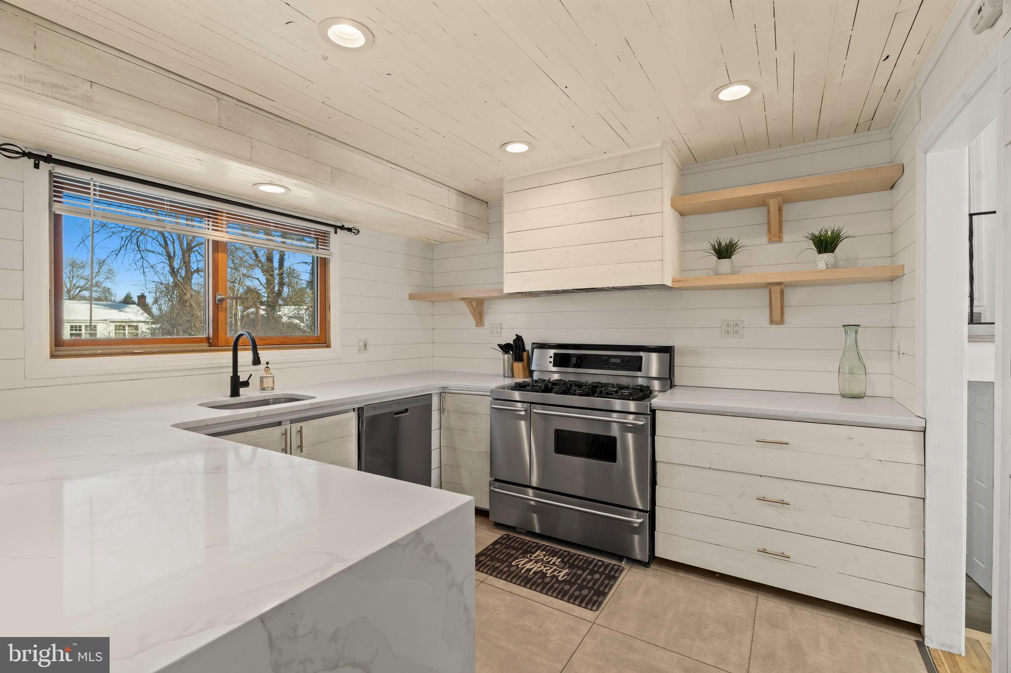 209 Front Street Mount Holly, NJ 08060 - Photo 32 of 35 Modern kitchen with sleek finishes and light.