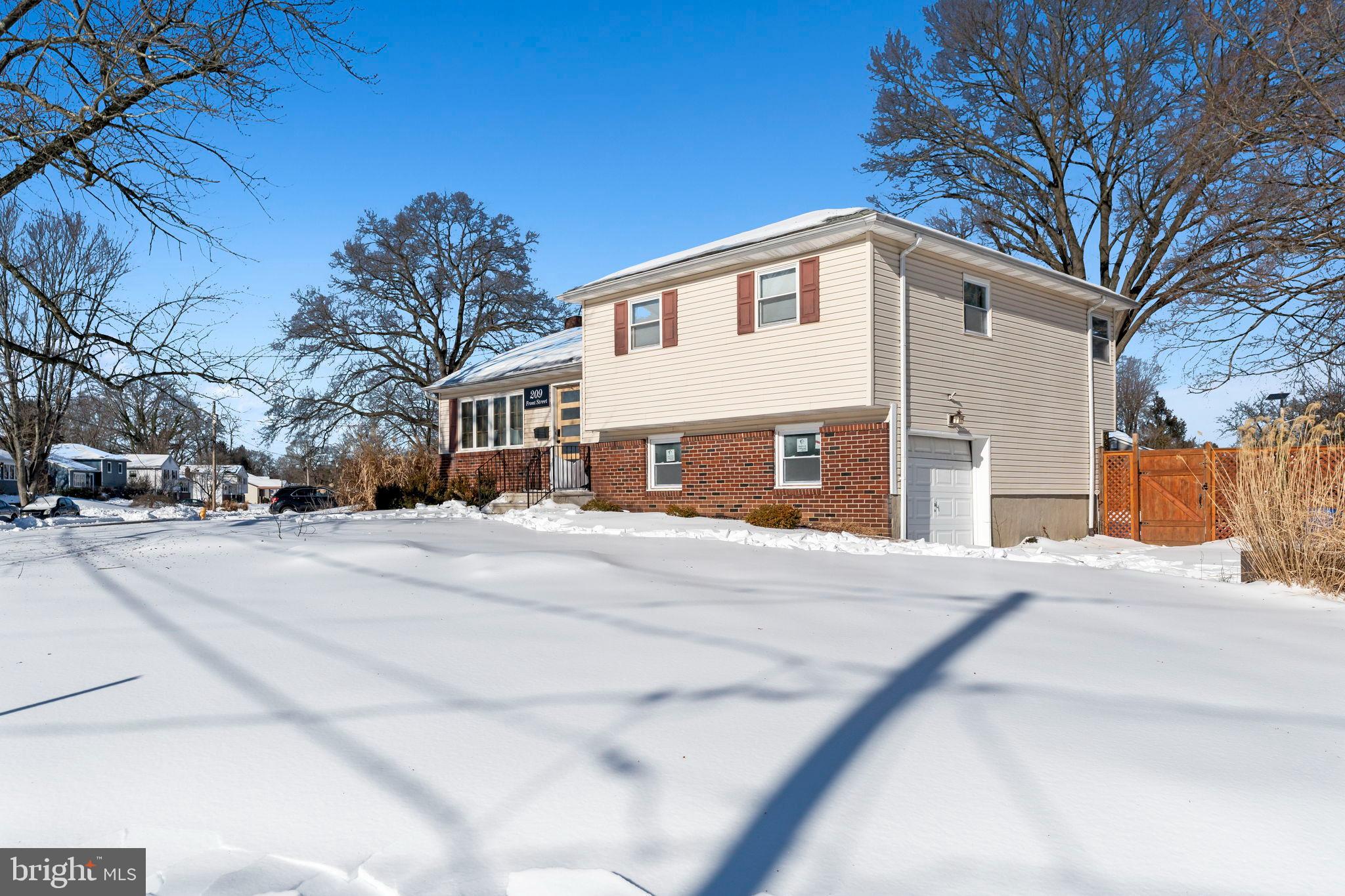 209 Front Street Mount Holly, NJ 08060 - Photo 4 of 35 a front view of a house with a yard