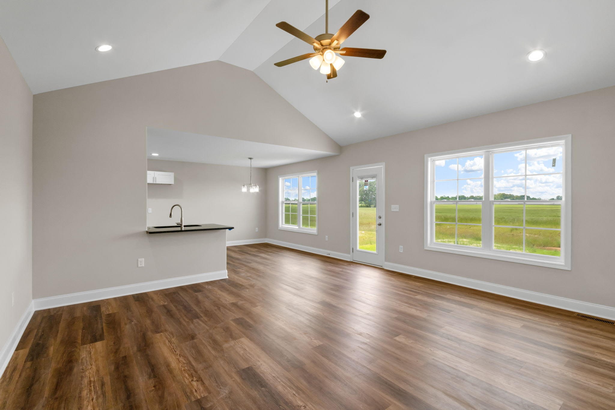 709 Victoria Way Franklin, KY 42134 - Photo 3 of 7 a view of an empty room with window and wooden floor