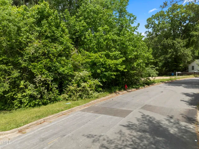 a view of a road with a yard