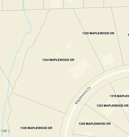 an aerial view of residential houses with outdoor and green space