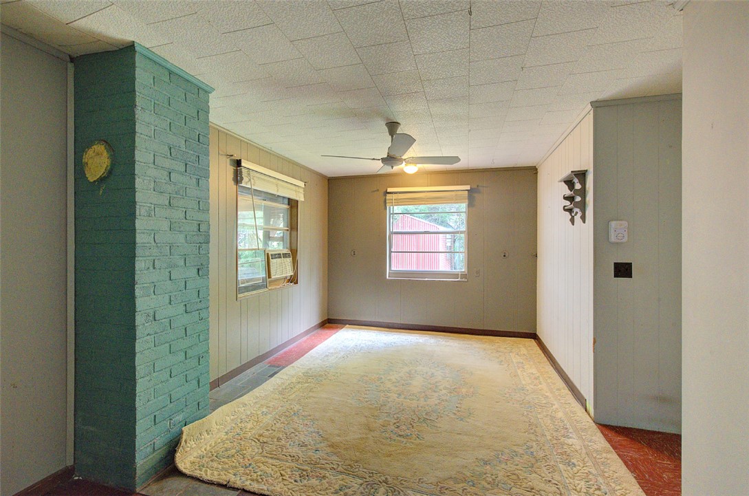 5064 Keowee School Road Seneca, SC 29672 - Photo 40 of 49 This versatile room features windows and a ceiling fan, offering comfort and natural light.
