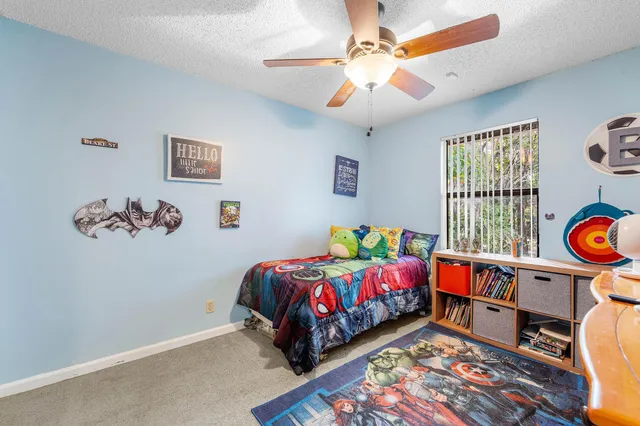 a bed room with a bed and a window