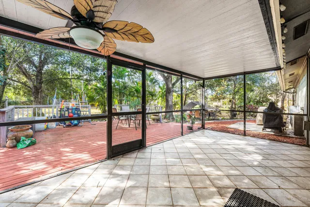 a view of a swimming pool with an outdoor seating