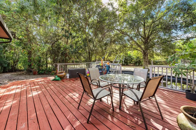 a view of a chairs and table on the wooden floor