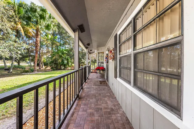 a view of a balcony with wooden floor