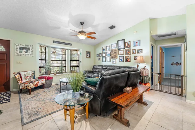 a bedroom with furniture and a chandelier
