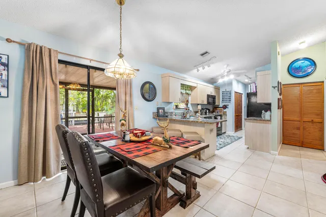 a outdoor dining space with furniture and a large window