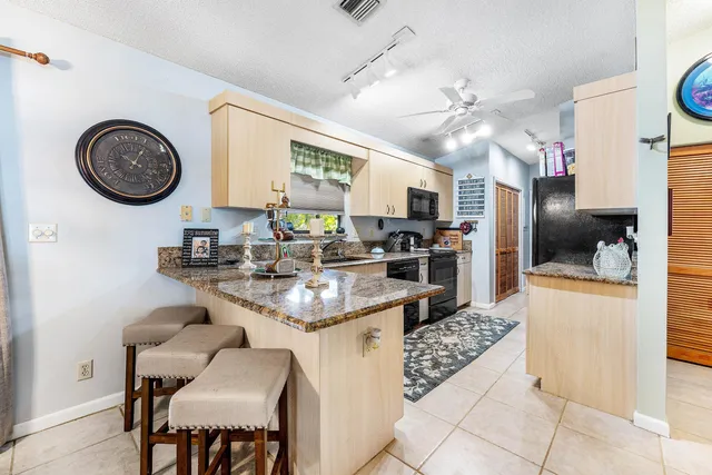 a kitchen with a dining table and chairs
